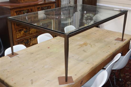 A bespoke patinated iron and glass coffee table L.127cm